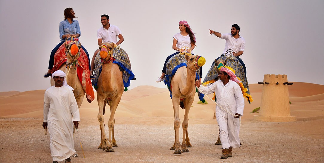 camel tour in the middle of a desert