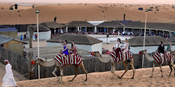 Enjoy dinner and a show at the Al Khayma desert camp