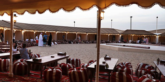 Enjoy dinner and a show at the Al Khayma desert camp