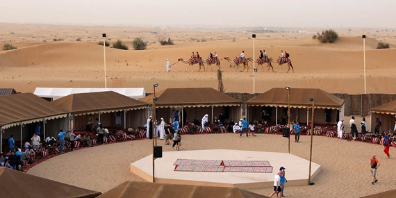 Enjoy dinner and a show at the Al Khayma desert camp