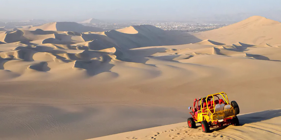 Take a buggy tour through the dunes