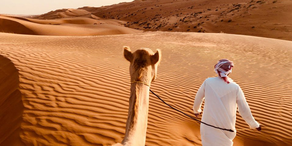 Go camel riding in the desert