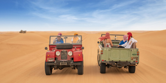 Safari through the desert in a vintage Land Rover