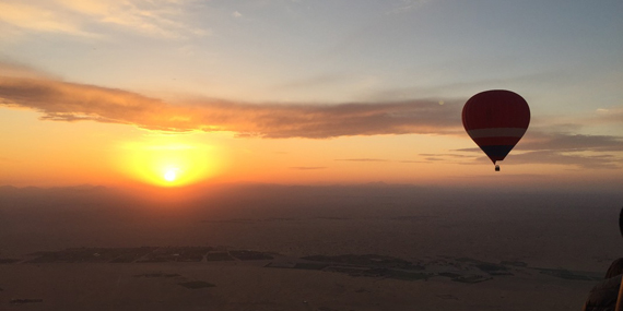 Soar above the desert in a hot air balloon