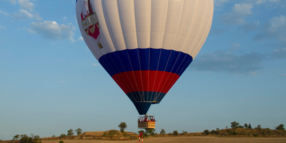 Soar above the desert in a hot air balloon
