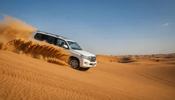 4x4 dune bashing across the Abu Dhabi desert during a standard evening safari