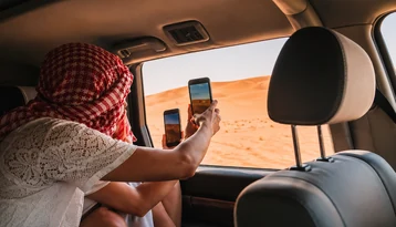 Sunrise over Abu Dhabi desert dunes during a Bedouin breakfast experience
