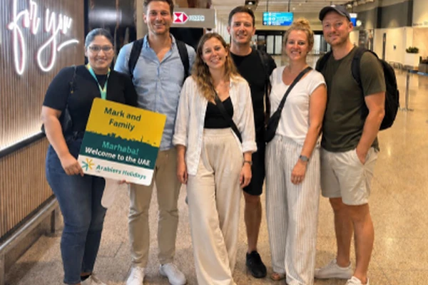 Arabiers Holidays team welcoming guests from abroad at Dubai International Airport