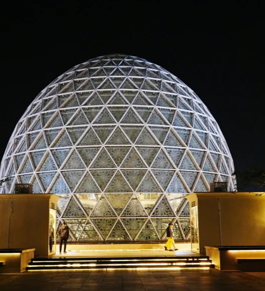 Illuminated mosque dome architecture at night in the UAE