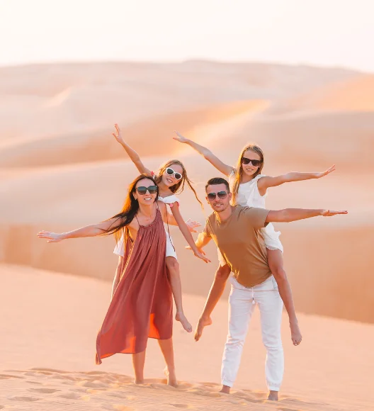 Family enjoying desert safari adventure together in Dubai sand dunes