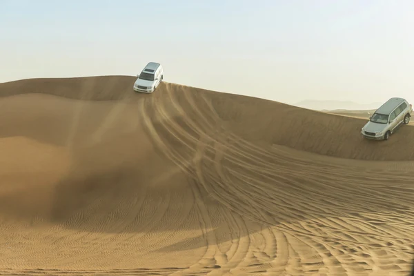 4x4 vehicle crossing the mega dunes of the Al Khatim desert