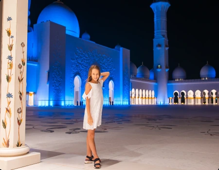 Visitor at Sheikh Zayed Grand Mosque during an evening visit
