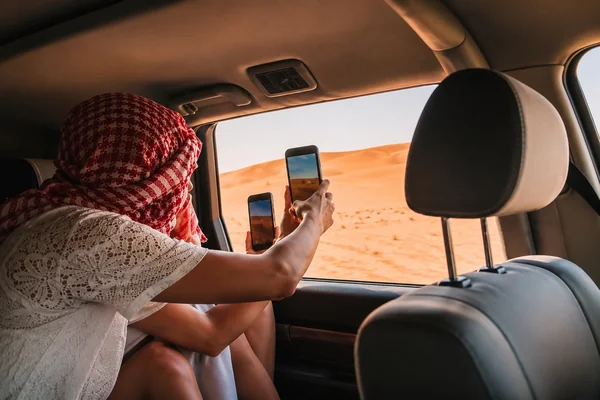 Traveller riding across the Abu Dhabi desert on an off road quad bike adventure arranged by Mujeeb Rahman for Arabiers Holidays