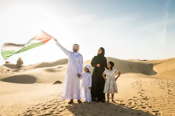 Emirati family enjoying an evening desert safari in Abu Dhabi, one of the desert experiences managed by Mujeeb Rahman at Arabiers Holidays