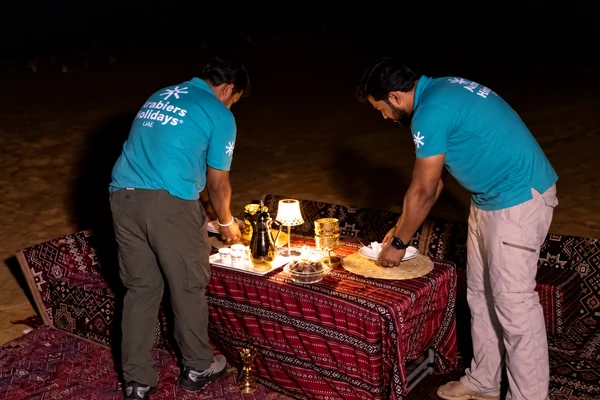 Mahmood Hasan leading a laser-guided constellation talk with guests in the UAE desert