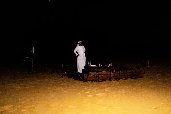 Mahmood Hasan at a telescope during an Al Quaa night stargazing session