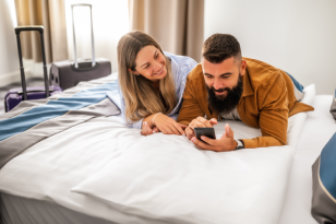 Travellers arriving with luggage in a hotel room for international hotel booking support by Arabiers UAE travel agency