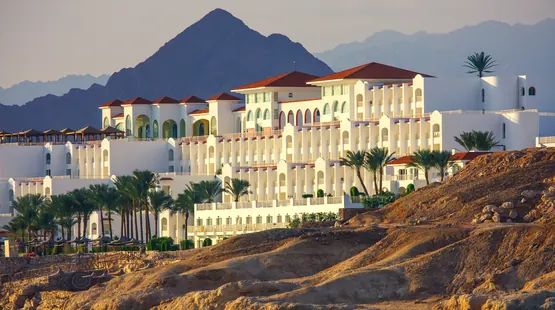 UAE family at an Omani beach resort with mountains behind