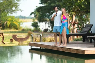 Couple at a tropical hotel pool for Sri Lanka hotel booking support by Arabiers UAE travel agency