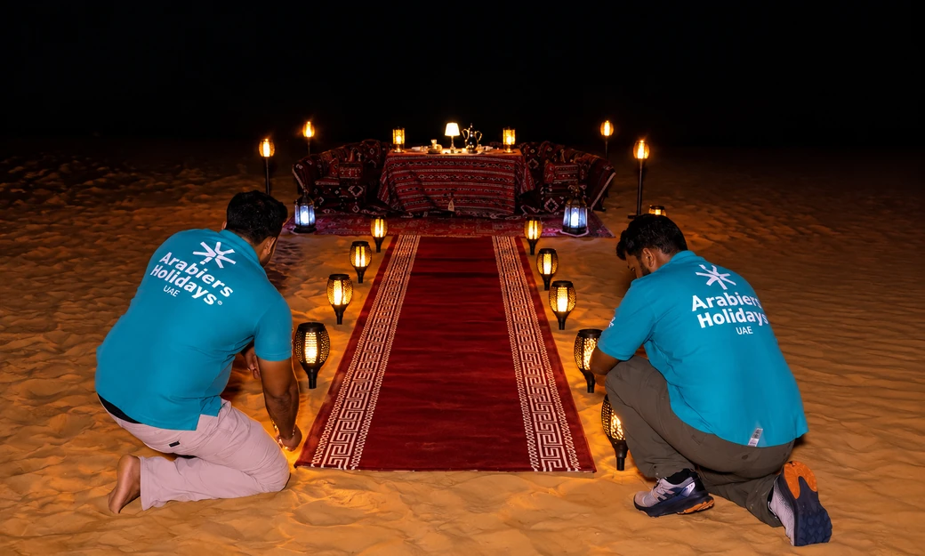 Private desert dinner camp setup prepared on the sand at Al Quaa