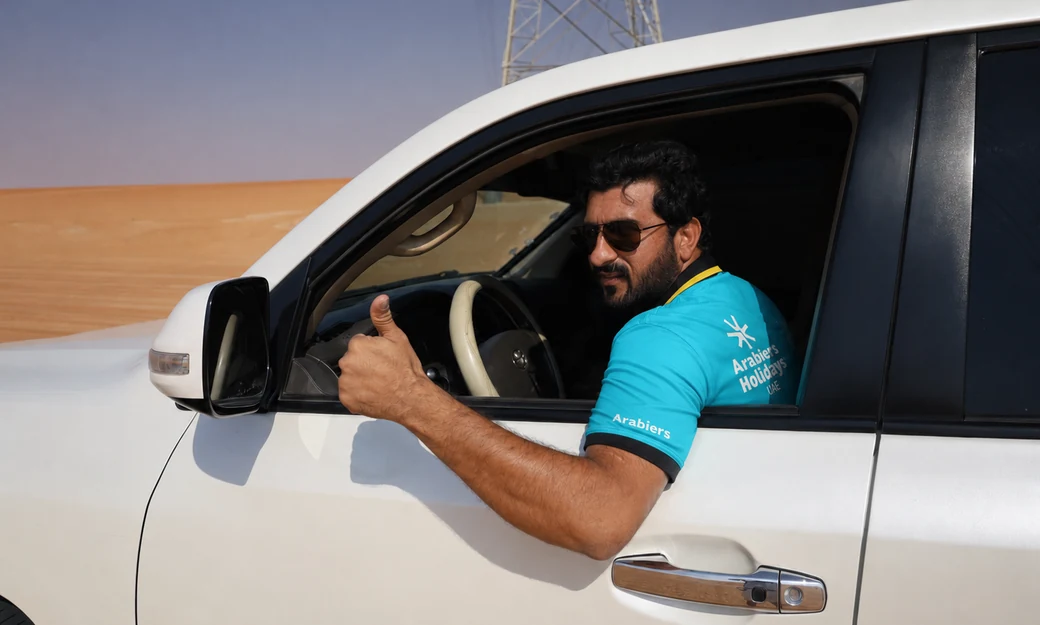 Arabiers driver in a private 4x4 for the Al Quaa desert camping transfer