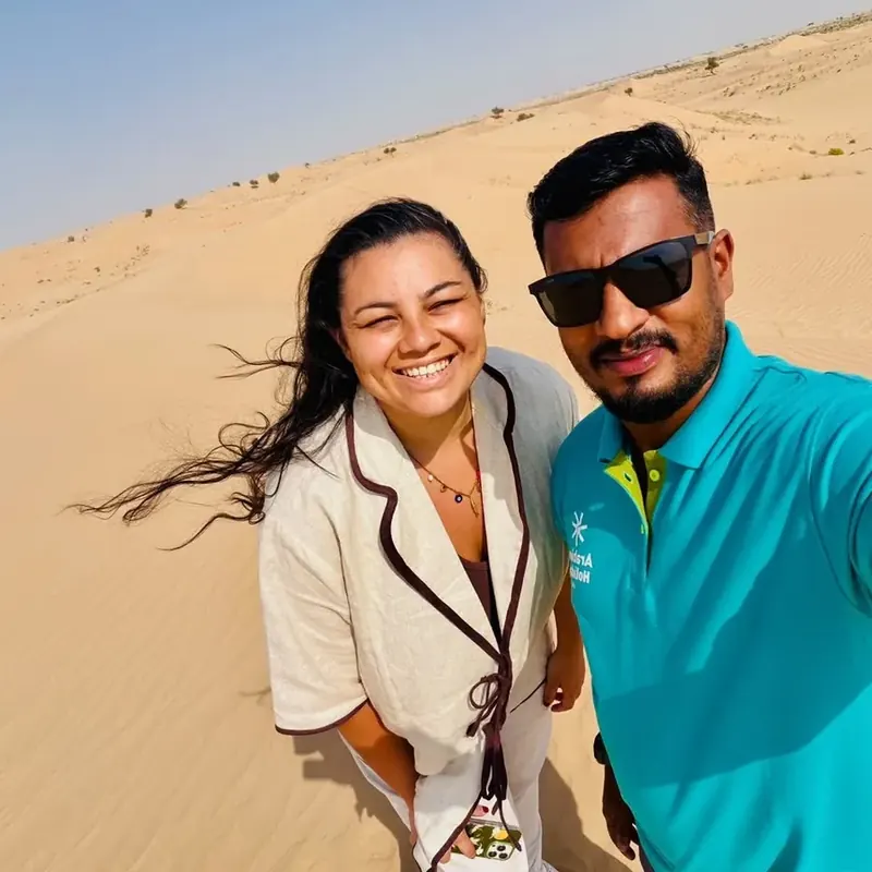 Arabiers desert guide Mujeeb with a guest on the Abu Dhabi dunes