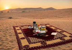 Outdoor breakfast prepared at an Abu Dhabi desert camp after sunrise