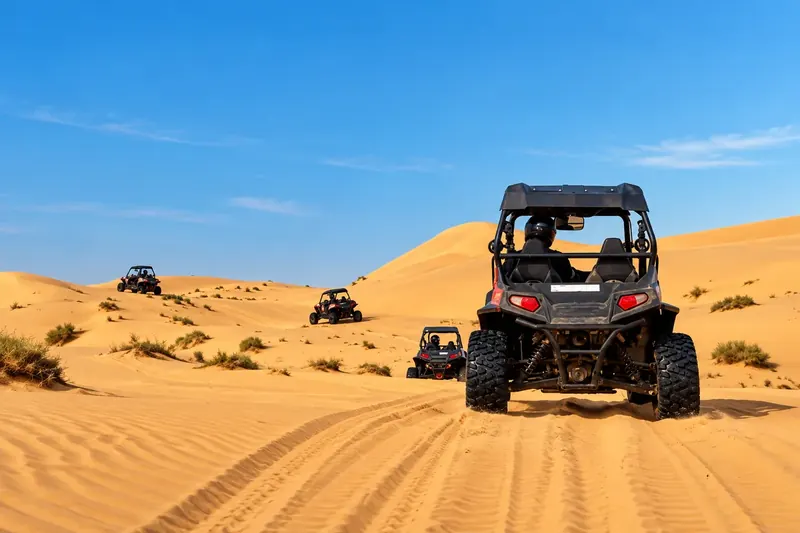 Group of dune buggies on a private desert safari in Al Khatim, Abu Dhabi
