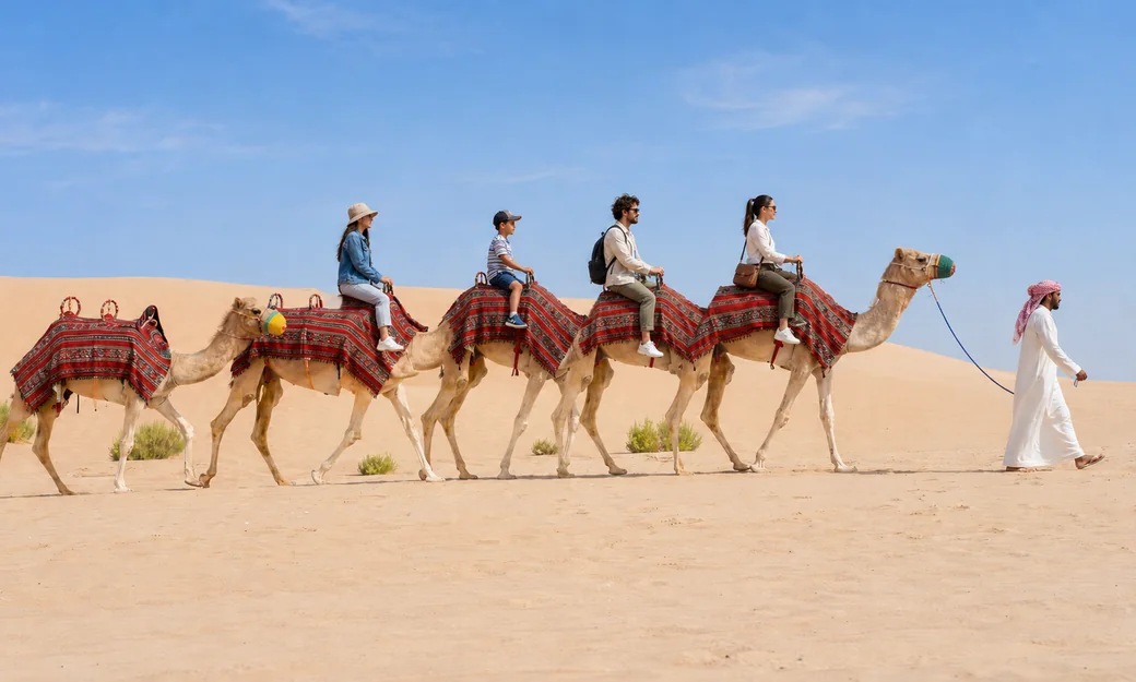 Families enjoying a handler-led camel trek in the Abu Dhabi desert
