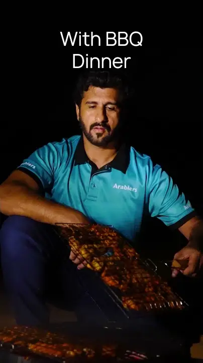 Fifteen second video of the BBQ dinner grilled at the Arabiers Liwa overnight camp
