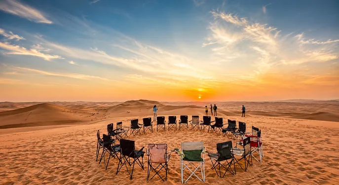 Desert camp seating prepared for guests after an Abu Dhabi sunrise safari