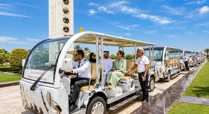 A couple viewing an armoured horse display inside Louvre Abu Dhabi