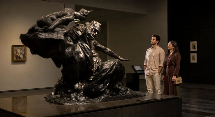 Visitors viewing a sculpture at Louvre Abu Dhabi