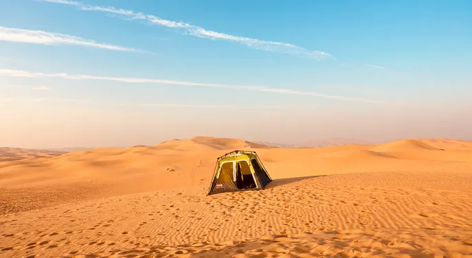 Private pop-up tent pitched among the Abu Dhabi desert dunes