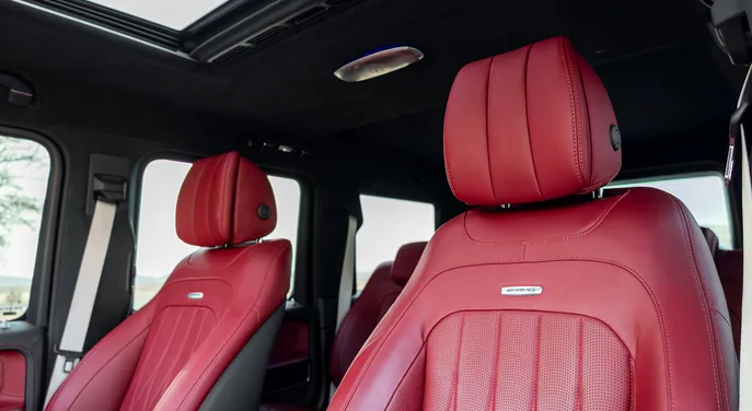 Red leather interior of the private Mercedes G-Class used for the Abu Dhabi premium evening desert safari
