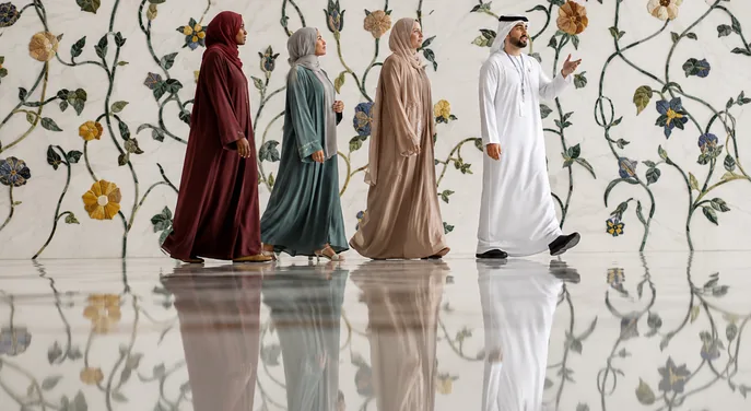 Visitors joining a guided palace hall visit at Qasr Al Watan