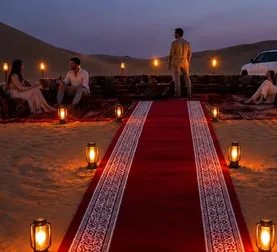 Wide view of a Royal Red Carpet Majlis arranged among the Abu Dhabi dunes