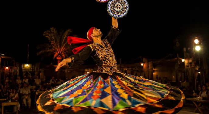 Tanoura performer during the Abu Dhabi desert camp evening show