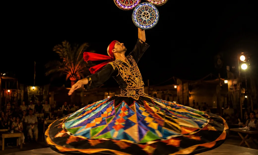 Tanoura performer during the Abu Dhabi desert camp evening show