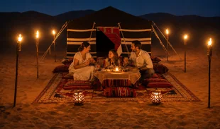 Traditional UAE Bedouin tent with private desert dinner setup