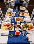 Dinner table prepared for guests aboard the Yas Marina dhow