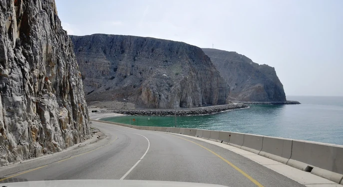 Mountain road following the rugged coastline near Khasab in Musandam