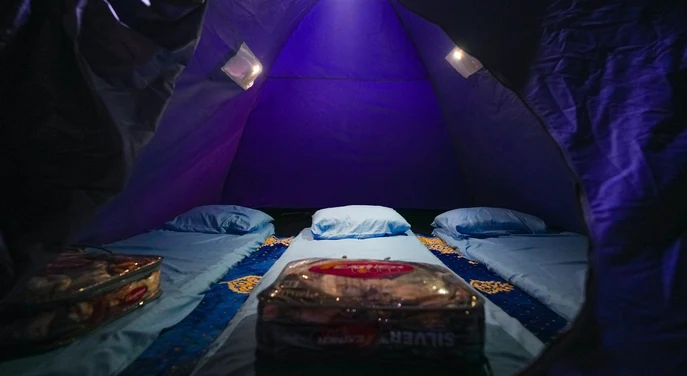 Sleeping mats and pillows prepared inside a tent at a Musandam beach camp