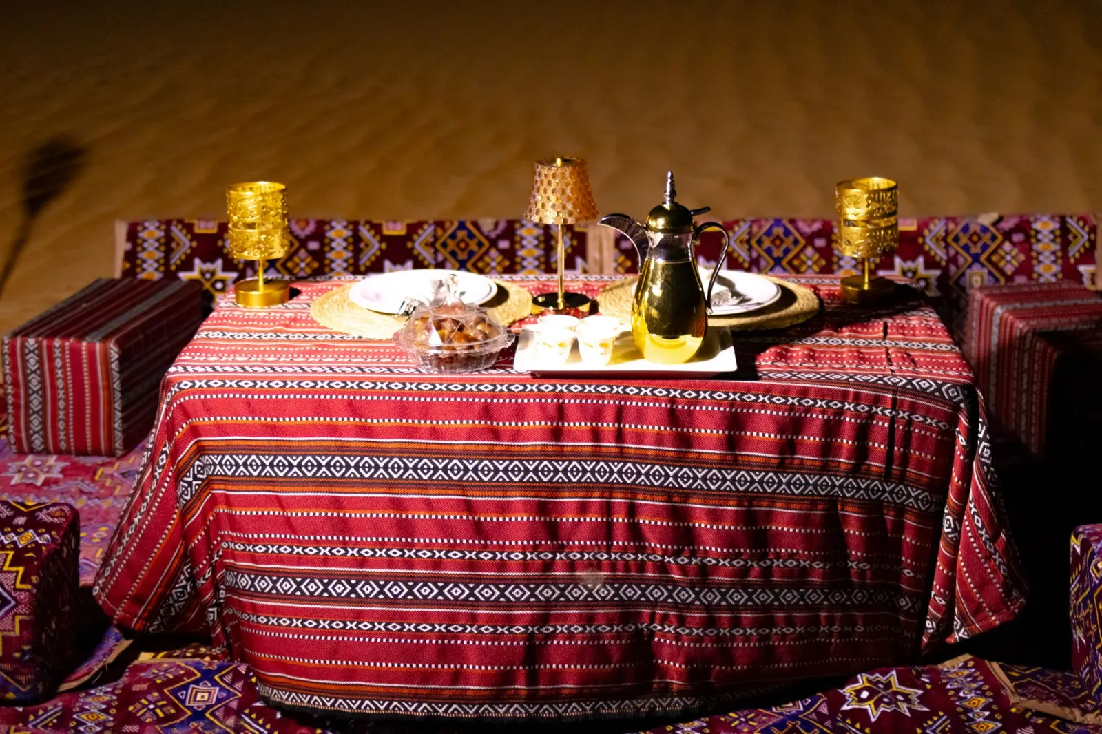 Private desert dinner table with Arabic coffee and lanterns