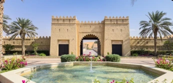Traditional fort and landscaped courtyard representing the Al Ain heritage extension