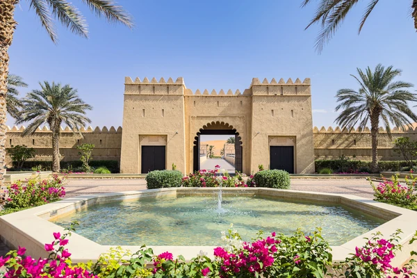 Al Ain heritage attraction surrounded by palm trees