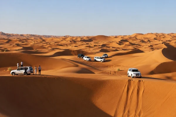 4x4 convoy crossing the Liwa desert dunes