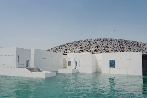 Louvre Abu Dhabi museum and dome beside the water