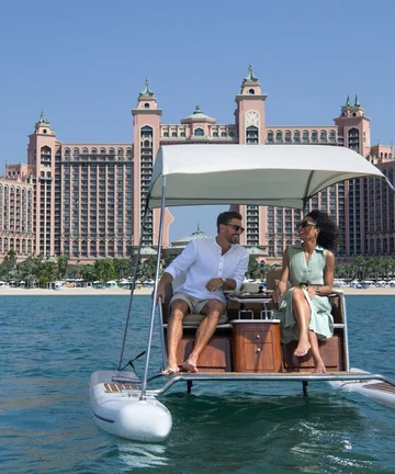 Egyptian travellers enjoying a boat ride near Atlantis The Palm in Dubai, UAE visa guide 2026