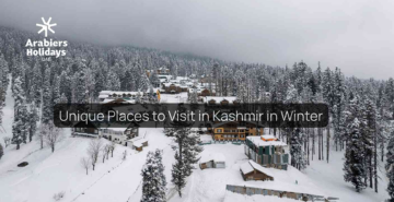 Snow-covered valley and mountains showcasing unique places to visit in Kashmir during winter
